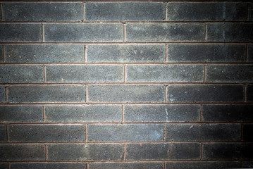 front on view of a gray brick wall backgound
