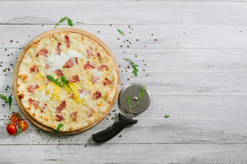 Pizza Carbonare with mozzarella, becon, egg and onion on the white background
