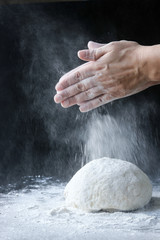 Obraz premium making dough with flour by female hands