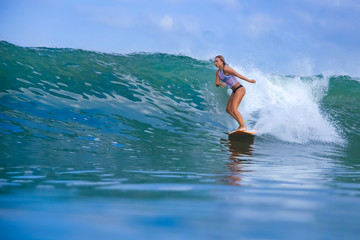 Fototapeta na wymiar Woman surfing