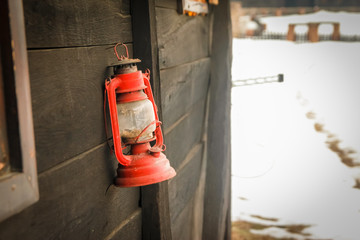 Old vintage lamp on the wall of the old rustic house