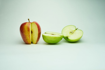 green and red apples on a white background