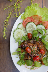 Spicy herbs salad with deep fried fish and vegetables vegetables Thai food
