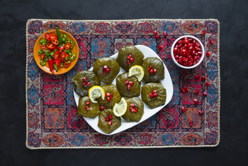 Fototapeta na wymiar Dolma Stuffed Grape leaves. Iranian cuisine. 