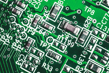 Green circuit board. Technology and electronics closeup background.