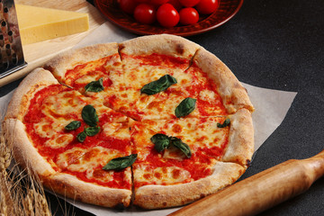 pizza margarita on dark background. Web banner, menu for restaurant or cafe, recipe concept. 