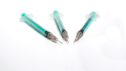 Fototapeta premium Insulin syringes on a white background.