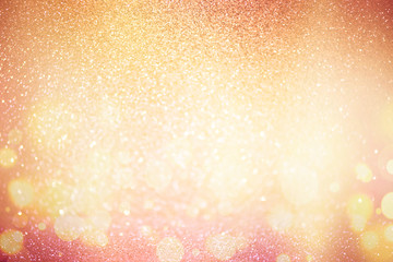 abstract defocused lights, sparkling holiday bokeh background with golden tones, elegant christmas...