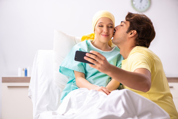 Husband looking after wife in hospital 