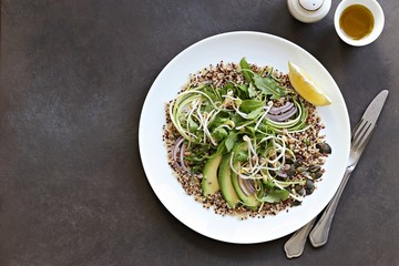 Quinoa detox salad with avocado, arugula, zucchini and seed mix. Plant based, clean eating, keto, super food. 