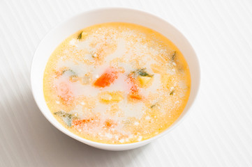 the white plate with fish soup