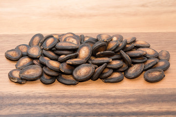 Watermelon seed on wood backgrounds