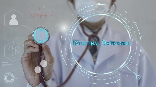 Intestinal Obstruction.Doctor using stethoscope on medicine background. Futuristic technology. data hologram healthy concept.