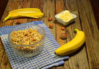 banana muesli with hazelnuts in a glass bowl