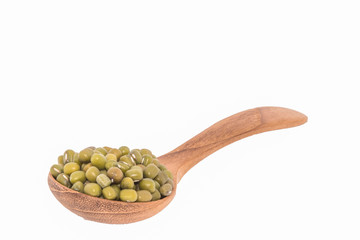 Green beans in wooden spoons on white backgrounds