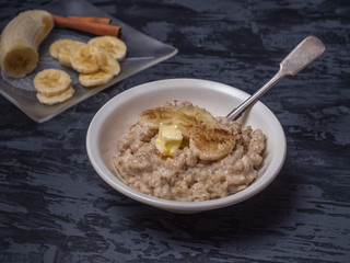 Hot oatmeal and sliced banana for breakfast.