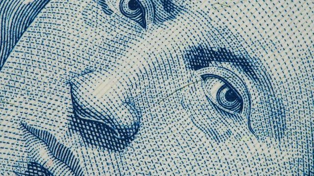 Christopher Columbus portrait on Bahamas banknote macro slow rotating. Stock video footage