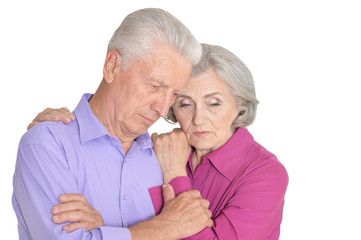 Portrait of sad senior couple isolated on white background