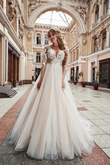 Obraz premium Beautiful delicate young woman, sexy bride in luxurious wedding dress