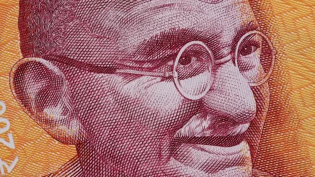 Mahatma Gandhi on India 200 rupee banknote slow rotating. Indian money currency bill. Stock video footage