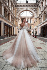 Obraz premium Beautiful delicate young woman, sexy bride in luxurious wedding dress