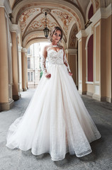 Obraz premium Beautiful sexy woman in a wedding dress in a charming castle.