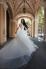 Obraz premium Beautiful sexy woman in a wedding dress in a charming castle.