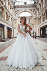 Obraz premium Beautiful sexy woman in a wedding dress in a charming castle.