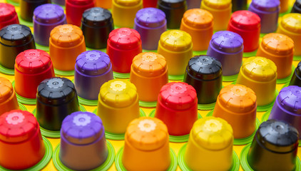 Coffee espresso capsules, eco friendly, compostable on yellow background