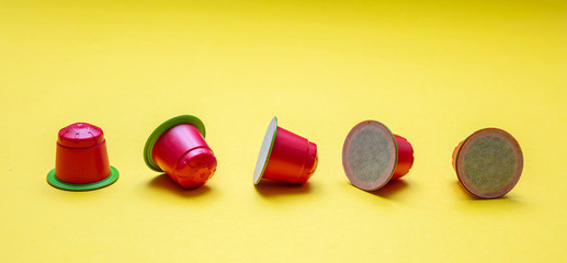 Coffee espresso capsules, eco friendly, compostable on yellow background