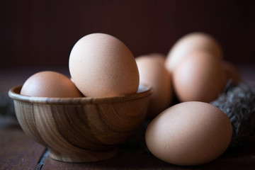 Eggs in wooden bowl and bird net