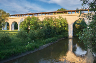 Ancient aqueduct on a summer evening. Aqueduct in Rostokino in Moscow, Russia