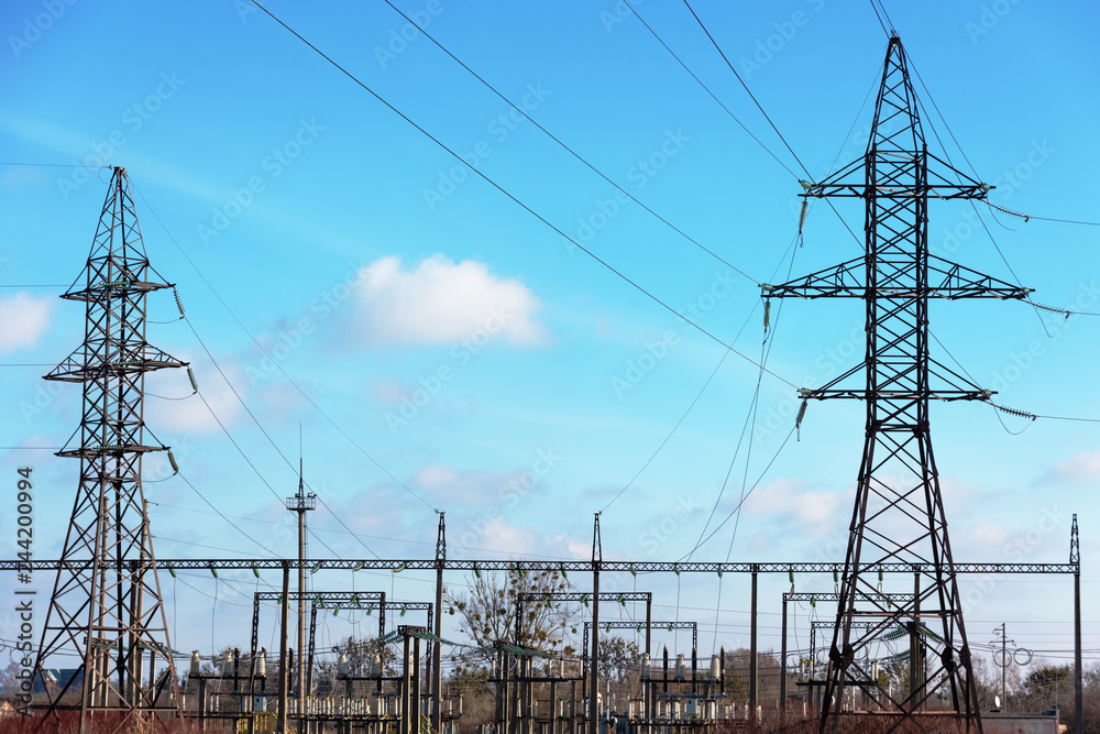 Wall mural View of electrics, electric lines on the background of blue sky and good weather.