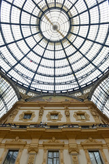 Architecture of the glass roof and walls of the Galleria Vittorio Emanuele, a popular retail shopping center in Milan Italy