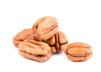 Pile of pecan nuts isolated over the white background. Bunch of peeled pecans