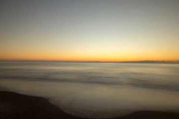 Sunrise on the beach in long exposure