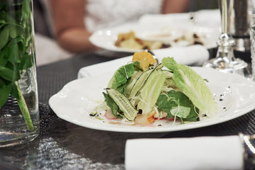 Vegetable food is on the table of outside restaurant