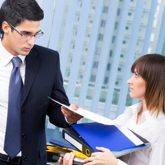 Businesspeople with documents at office