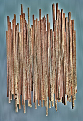 Vertical colorful wood slats on pale duck-egg blue washed background