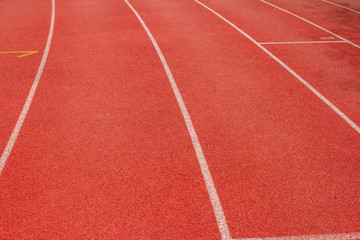 Fototapeta premium Red running track Synthetic rubber on the athletic stadium.