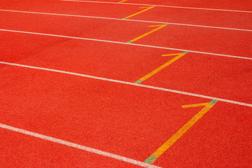 Red running track Synthetic rubber on the athletic stadium.