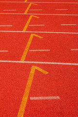 Red running track Synthetic rubber on the athletic stadium.