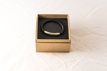 Braided leather men's bracelet with silver insert in the packing box