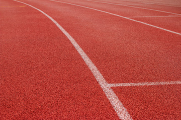 Fototapeta premium Red running track Synthetic rubber on the athletic stadium.
