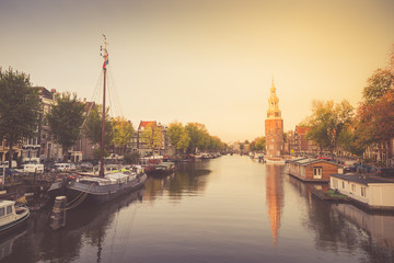 Typical view of canal embankment in historic center of city, Amsterdam, Netherlands.