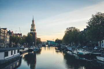 Typical view of canal embankment in historic center of city, Amsterdam, Netherlands.