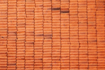 fragment of red roof tiles