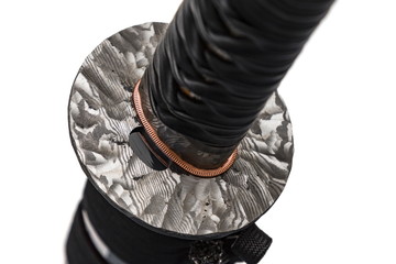 Tsuba : handguard of Japanese sword made of folded steel isolated in white background.