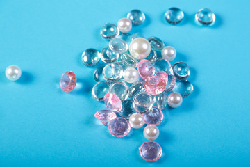 White and pink pebbles on a blue background.