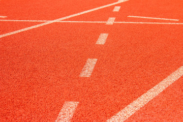 Red running track Synthetic rubber on the athletic stadium.